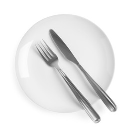 Photo of Ceramic plate, fork and knife on white background, top view