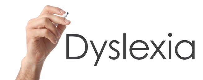 Image of Man writing word Dyslexia on white background, closeup. Banner design