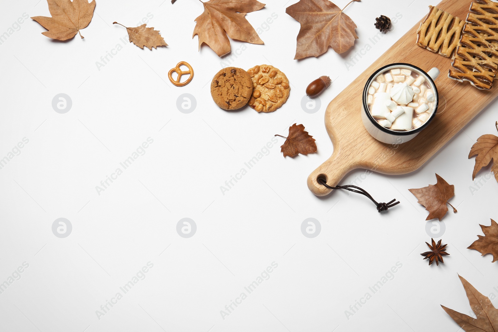 Photo of Flat lay composition with hot cozy drink and autumn leaves on white background. Space for text