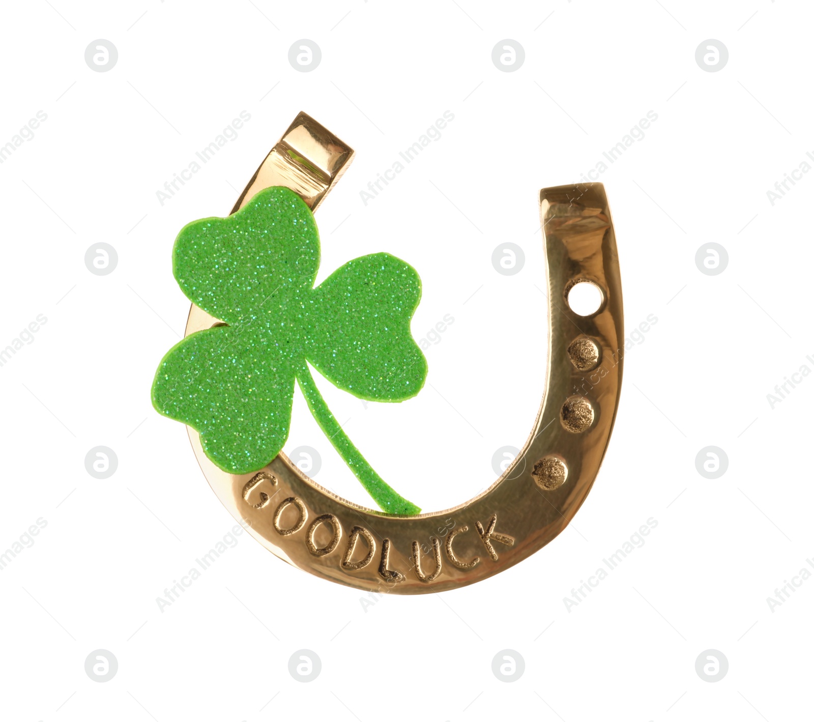 Photo of Golden horseshoe with phrase GOOD LUCK and clover on white background. St. Patrick's Day celebration