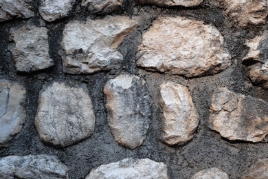 Photo of Old stone wall as background, closeup view