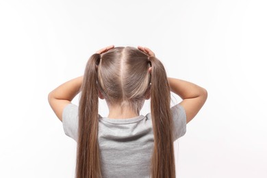 Dyslexia problem. Girl covering head with hands on white background, back view