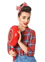 Funny young housewife with frying pan on white background