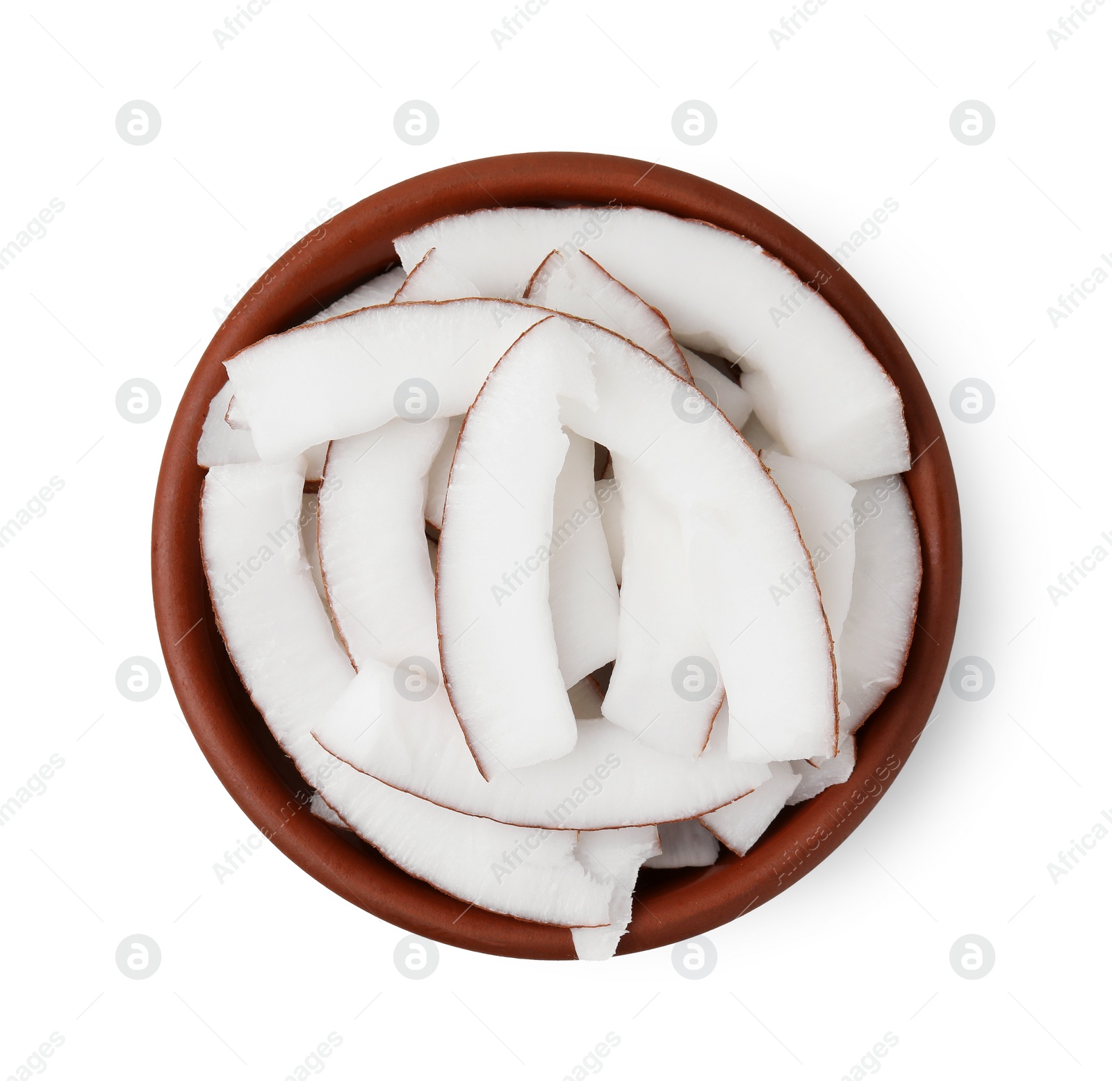 Photo of Coconut pieces in bowl isolated on white, top view