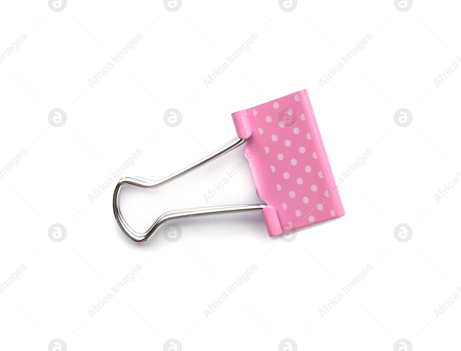 Photo of Pink binder clip on white background. Stationery for school