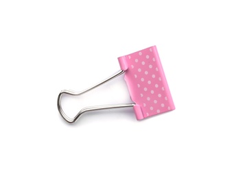 Photo of Pink binder clip on white background. Stationery for school
