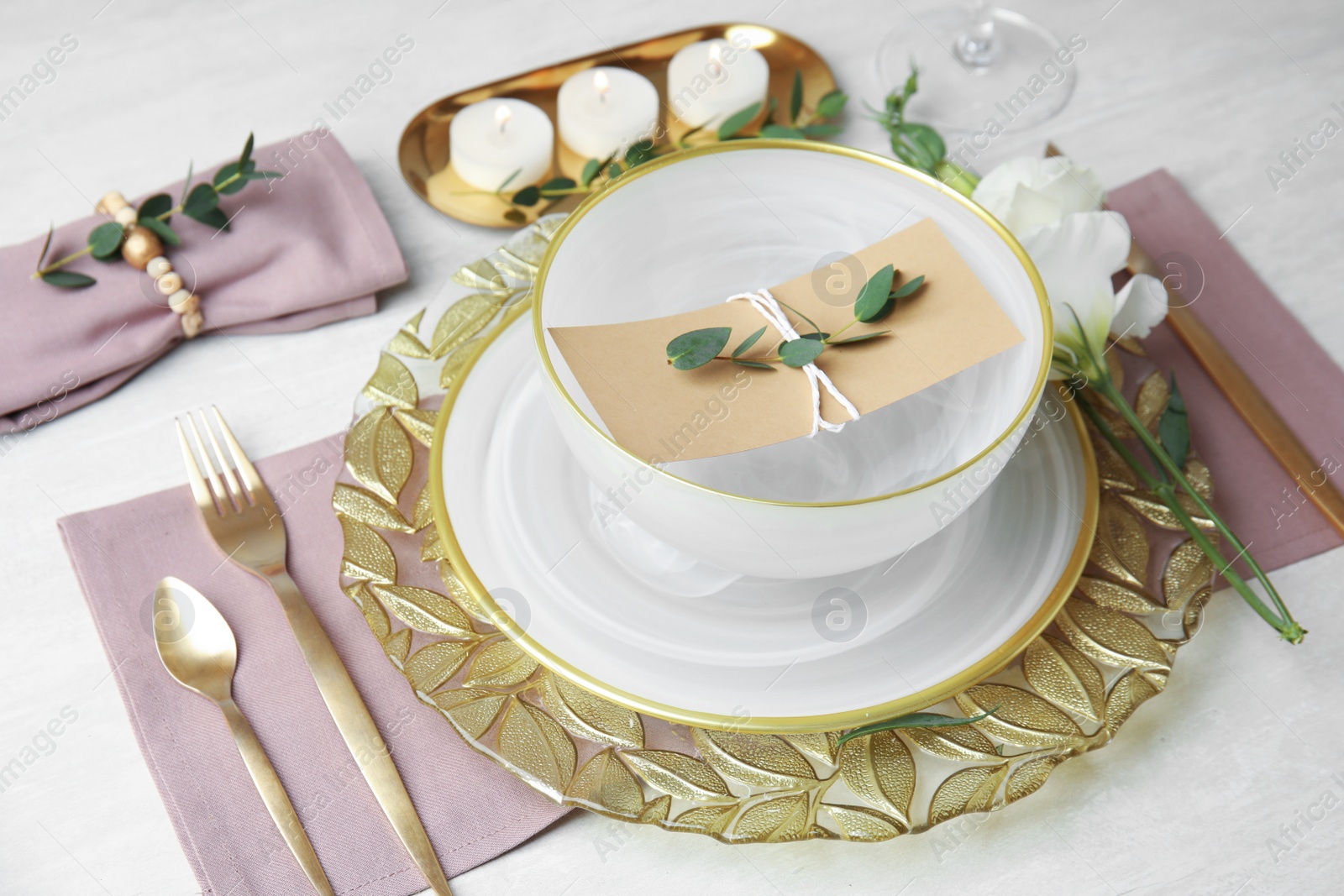 Photo of Elegant festive table setting on light background