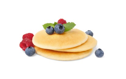 Photo of Tasty pancakes with berries isolated on white