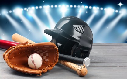 Image of Baseball bats, glove, helmet and ball on wooden table at stadium, banner design