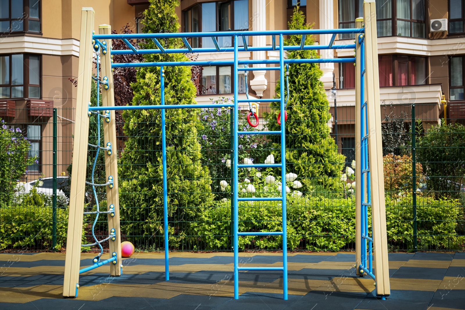 Photo of Empty monkey bars on outdoor children's playground in residential area