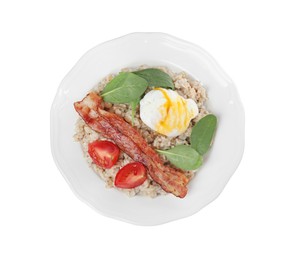 Photo of Delicious boiled oatmeal with poached egg, bacon and tomato isolated on white, top view