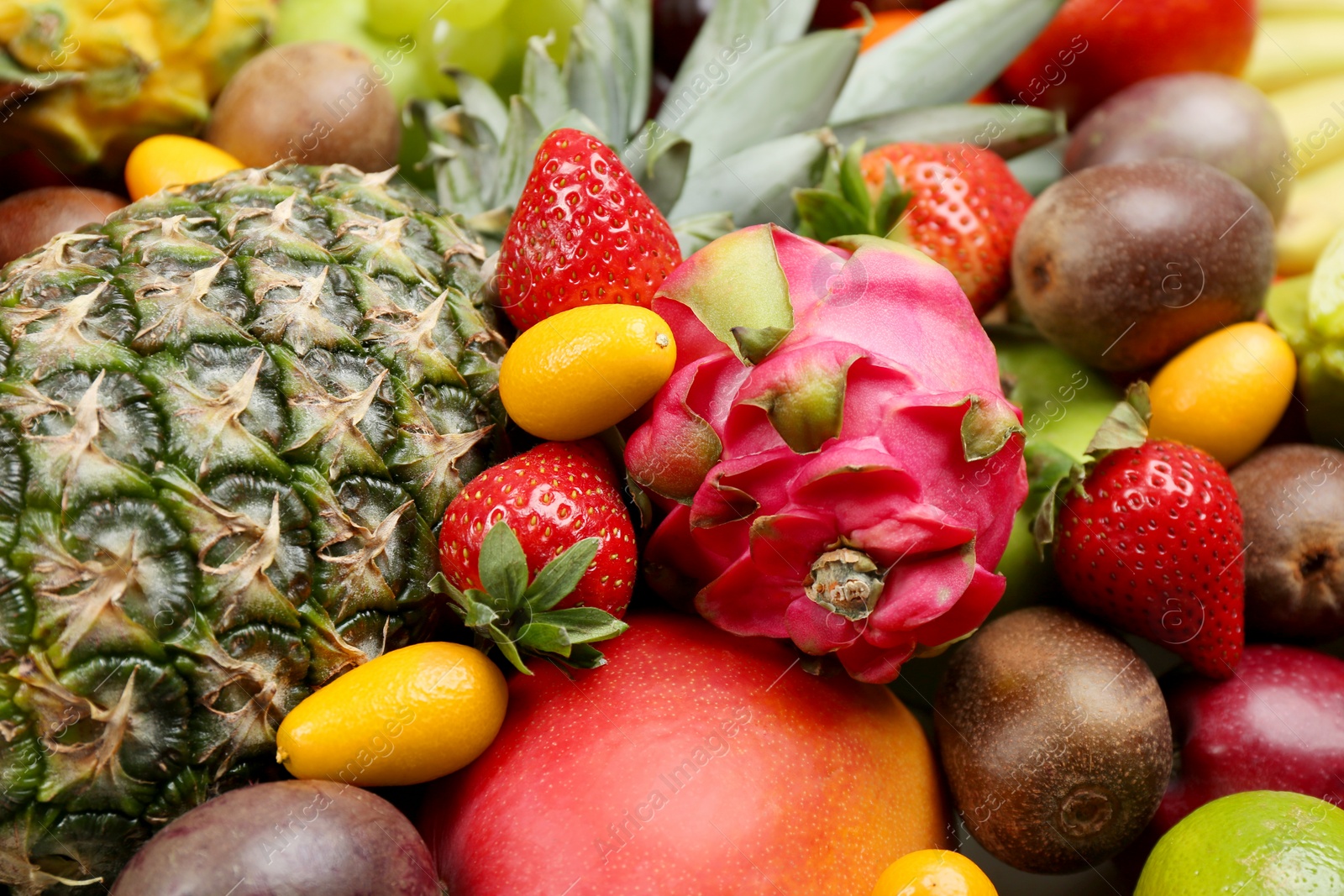 Photo of Assortment of fresh exotic fruits as background, closeup