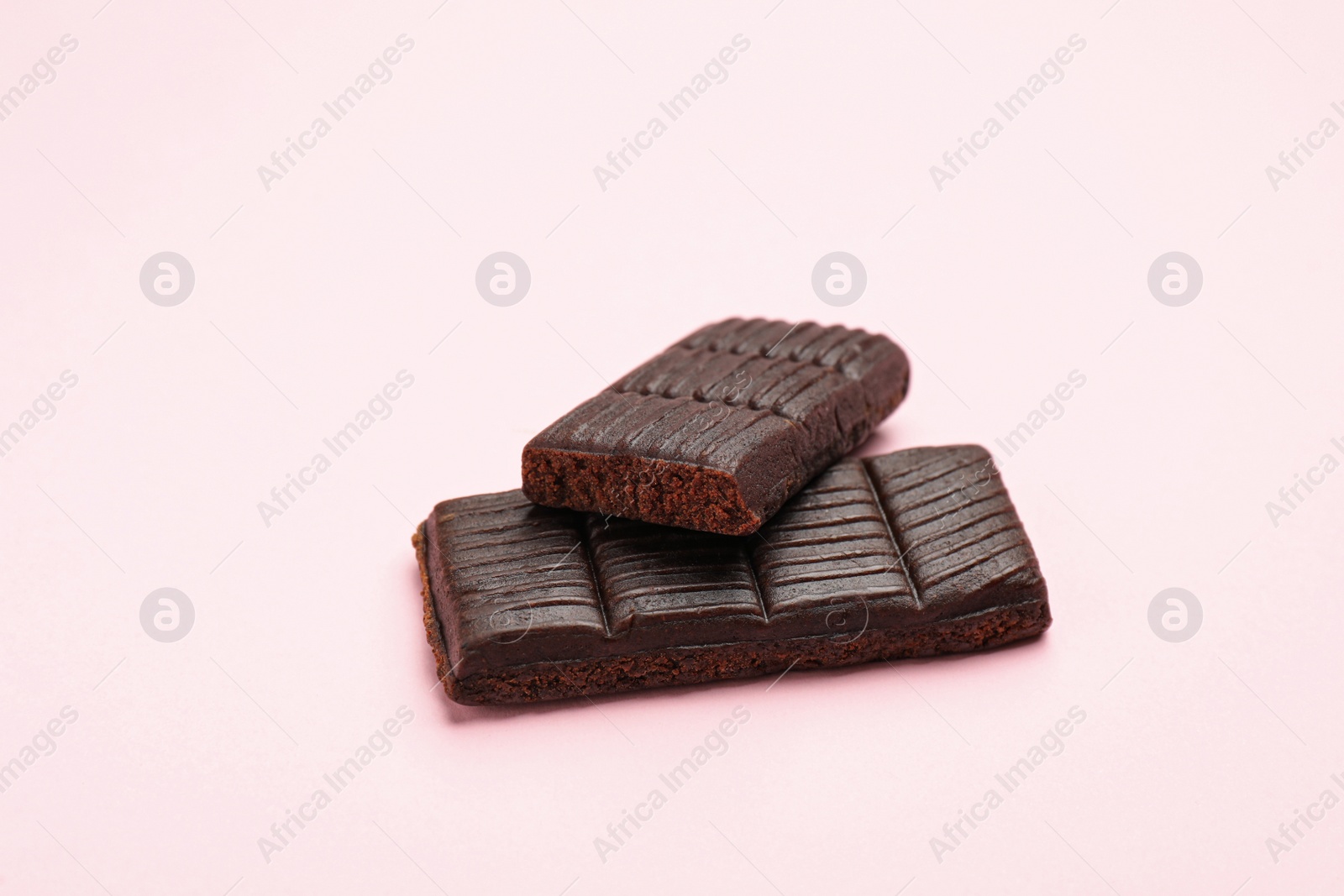 Photo of Delicious and healthy hematogen on pink background