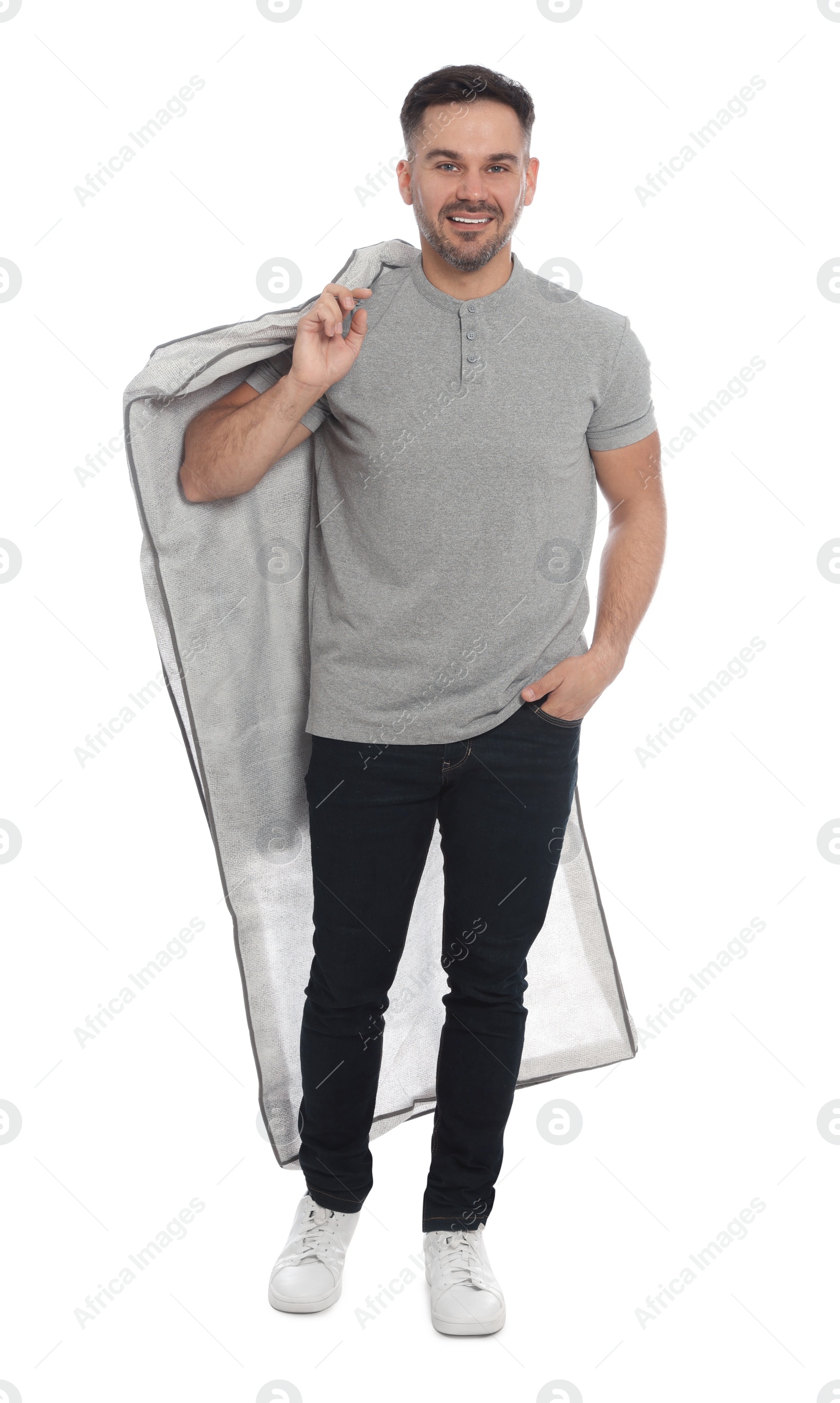 Photo of Man holding garment cover with clothes on white background. Dry-cleaning service