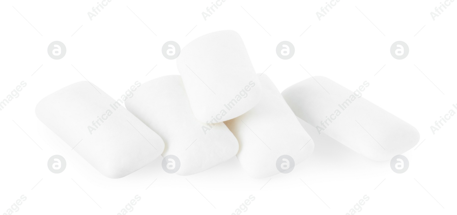 Photo of Pile of tasty chewing gums on white background