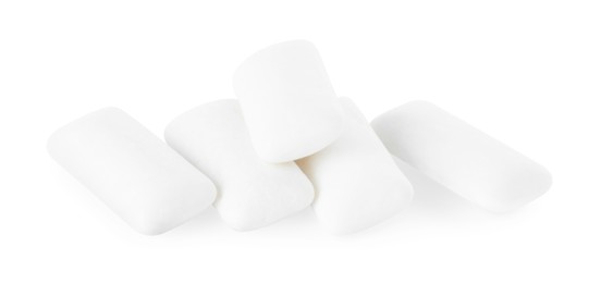 Photo of Pile of tasty chewing gums on white background