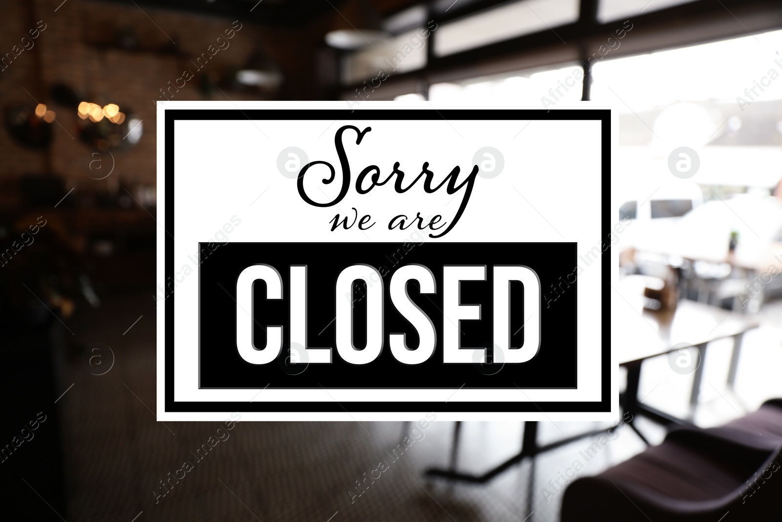 Image of Sorry we are closed sign against blurred background