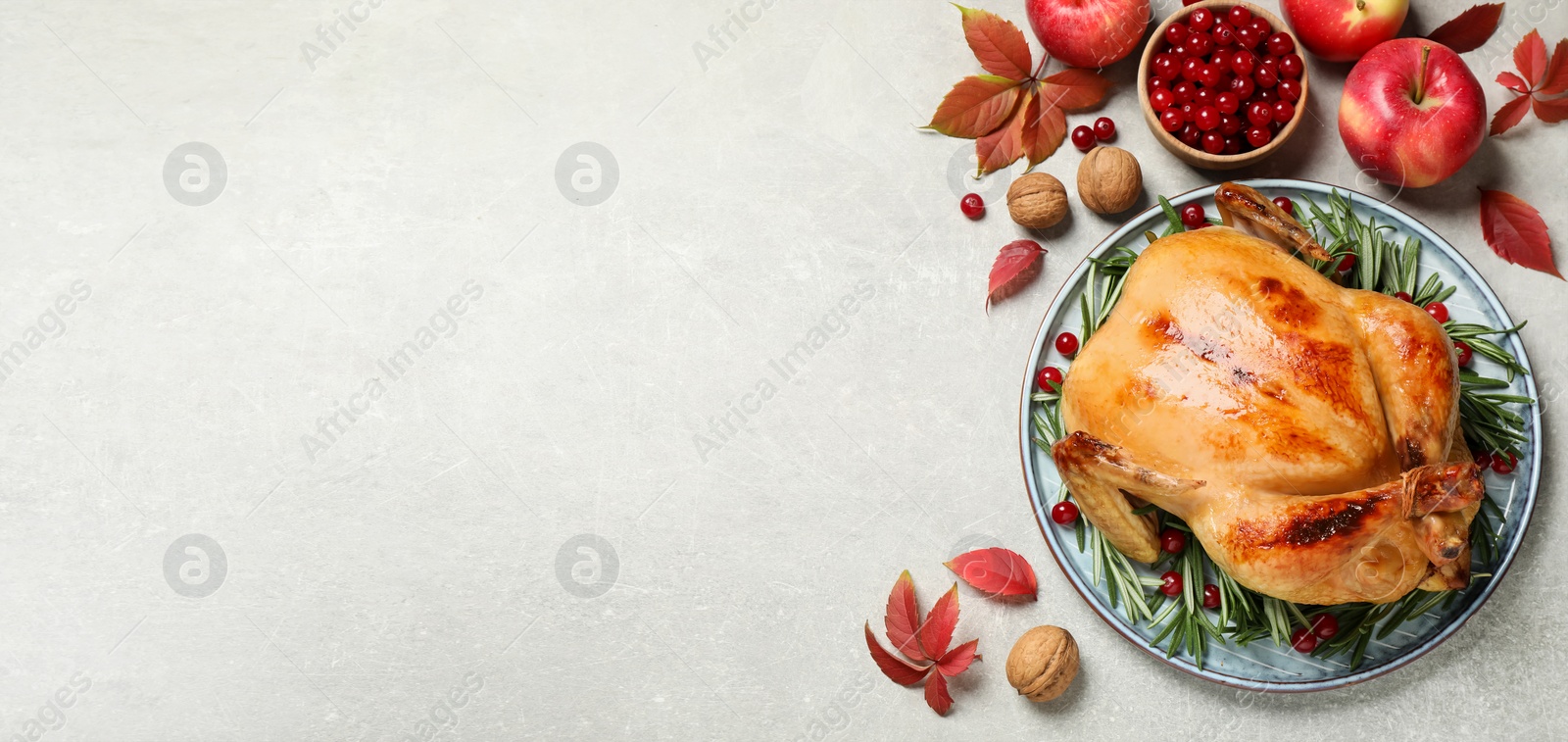 Image of Happy Thanksgiving Day, banner design. Traditional cooked turkey and autumn decor on light table, flat lay with space for text