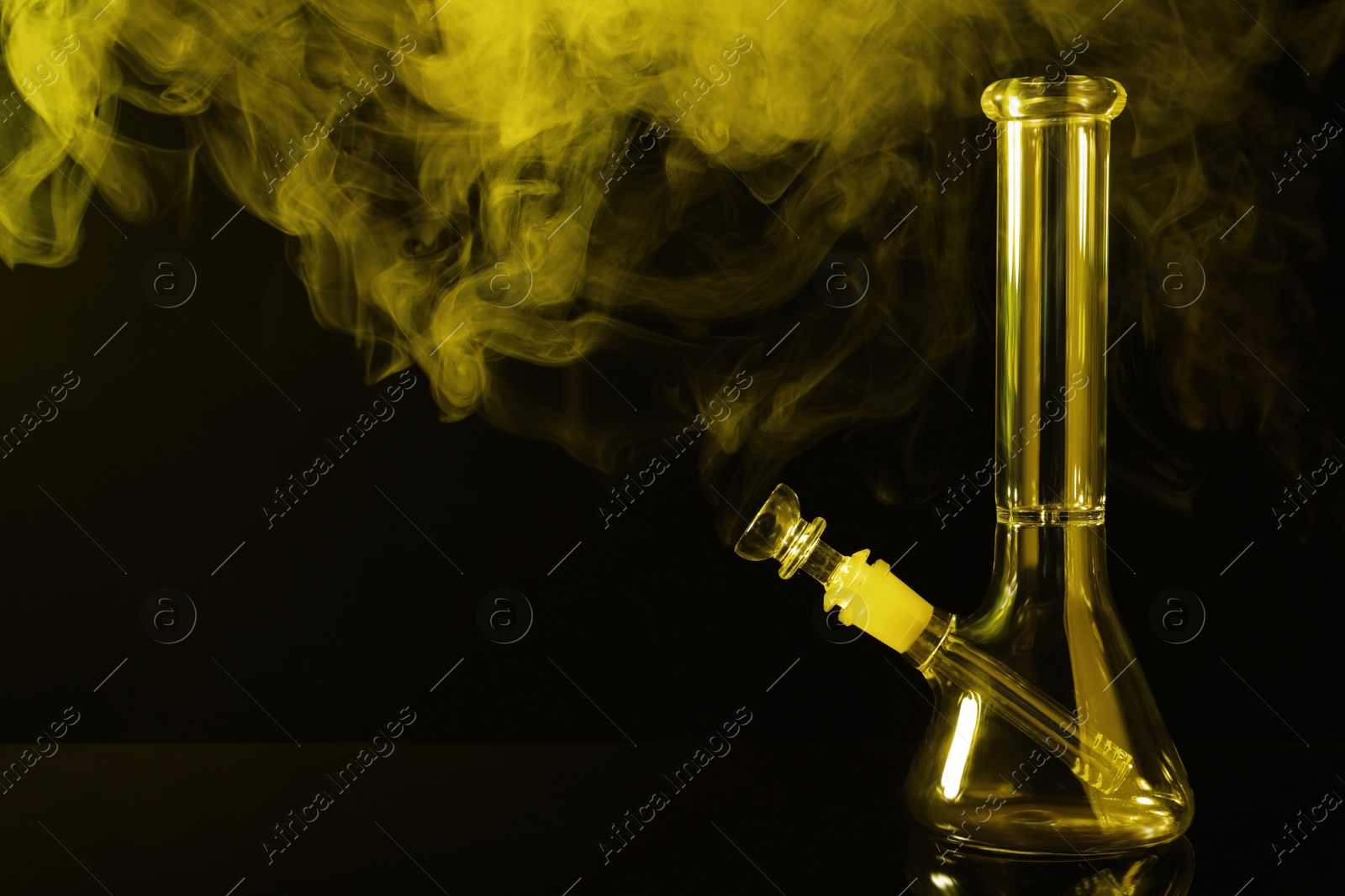 Photo of Glass bong and smoke on black background, space for text. Smoking device