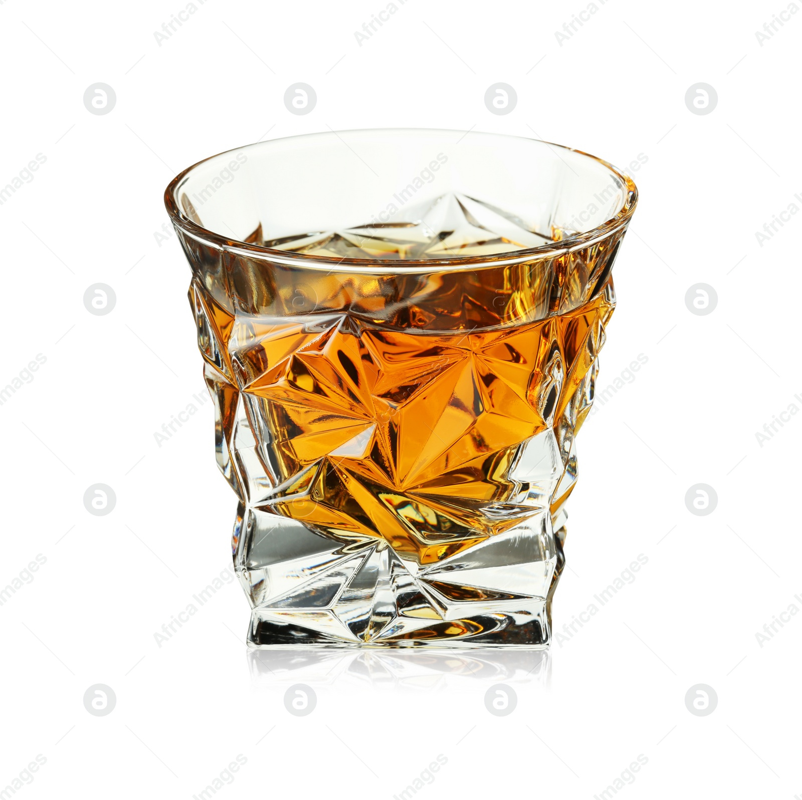 Photo of Whiskey in glass isolated on white. Alcoholic drink