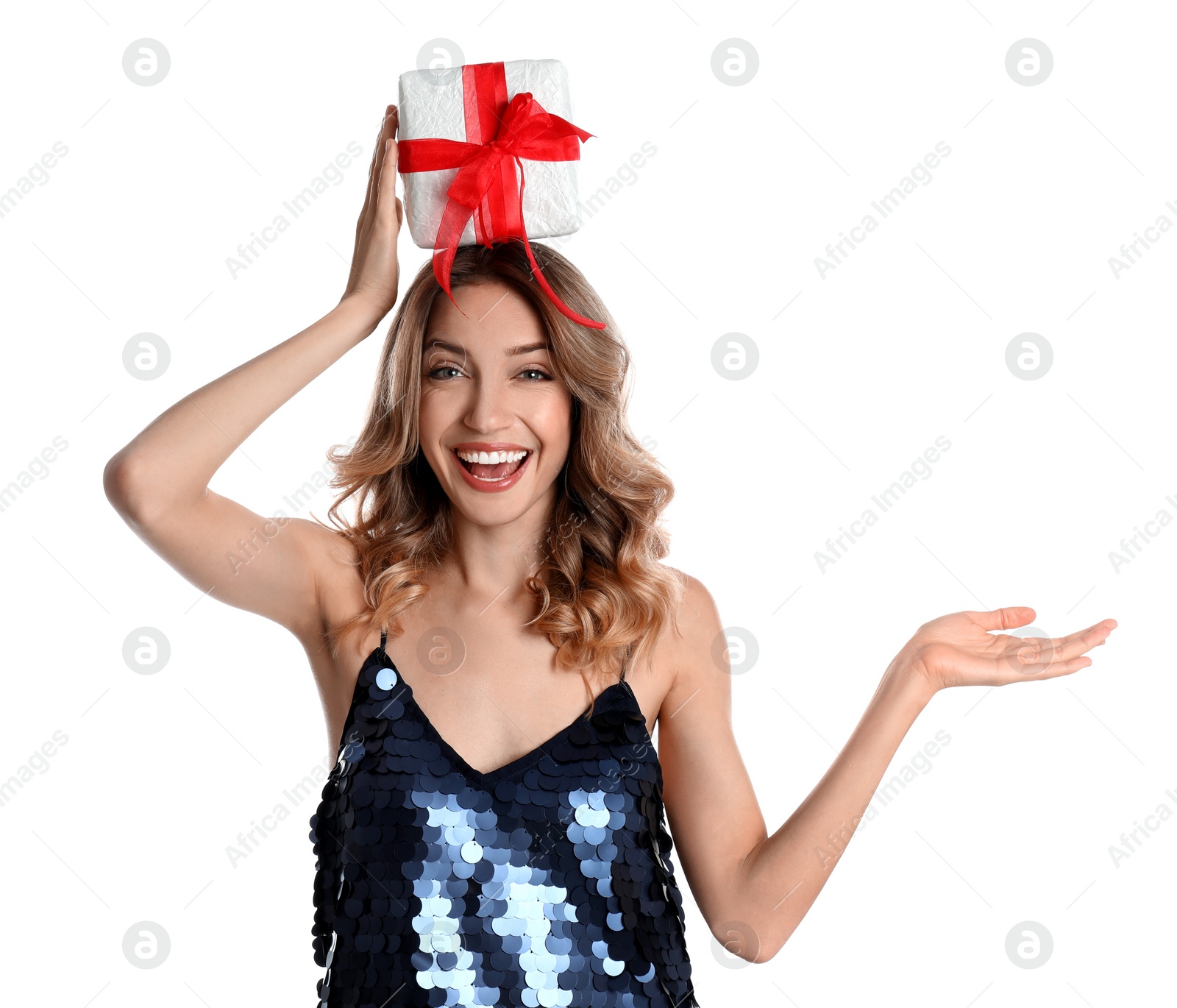 Photo of Beautiful young woman with Christmas present on white background