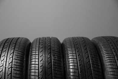 Car tires on grey background