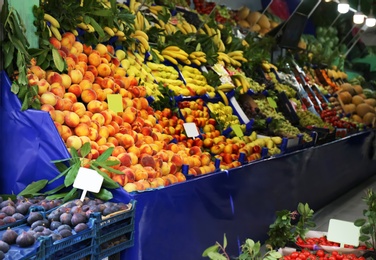 Photo of Tasty fresh fruits on counter at market