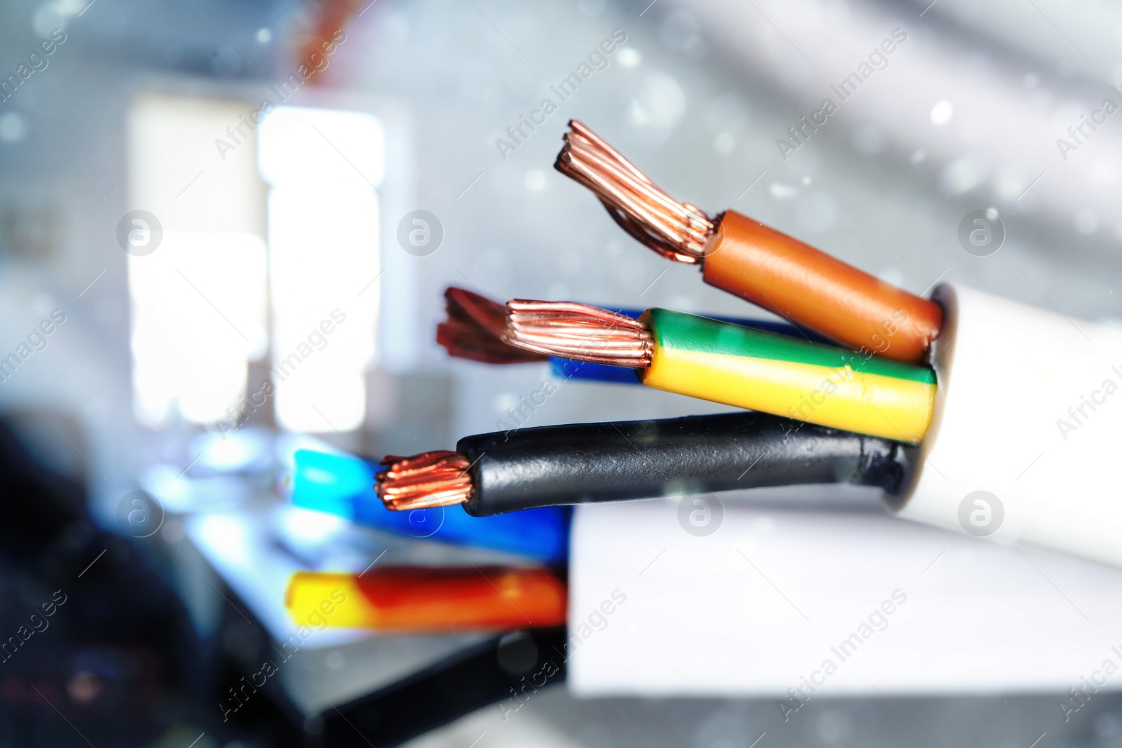 Image of Colorful electrical wires against blurred background, closeup