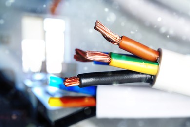 Colorful electrical wires against blurred background, closeup