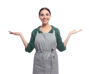 Photo of Young woman in grey apron on white background