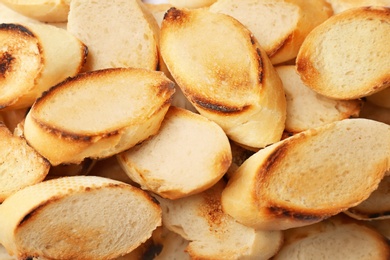 Toasted slices of bread as background, closeup