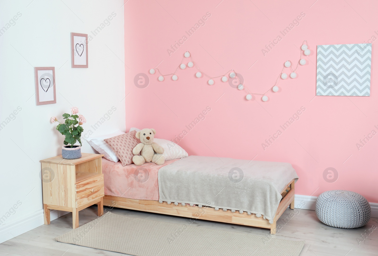 Photo of Cozy child's room interior with comfortable bed