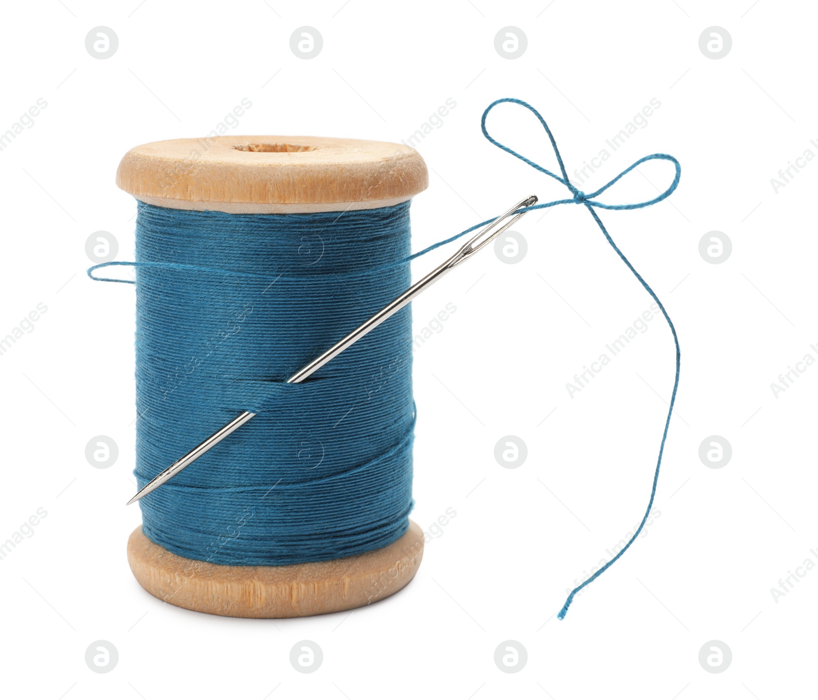 Photo of Light blue sewing thread with needle on white background