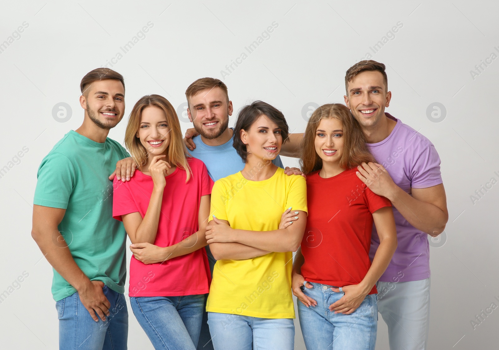 Photo of Group of young people on light background. Unity concept