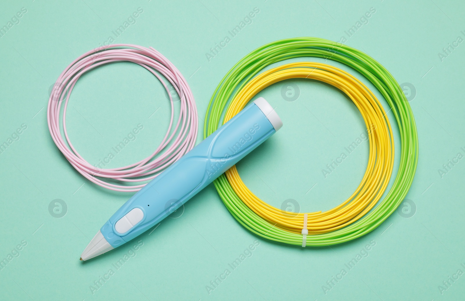 Photo of Stylish 3D pen and colorful plastic filaments on turquoise background, flat lay