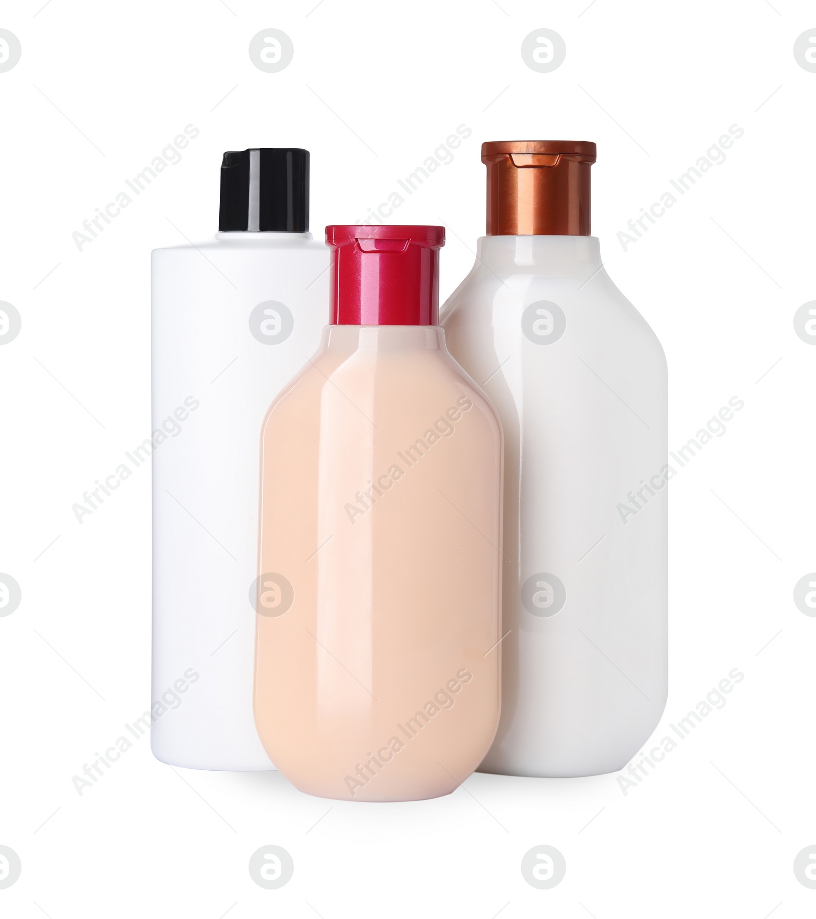 Photo of Different bottles of shampoo on white background