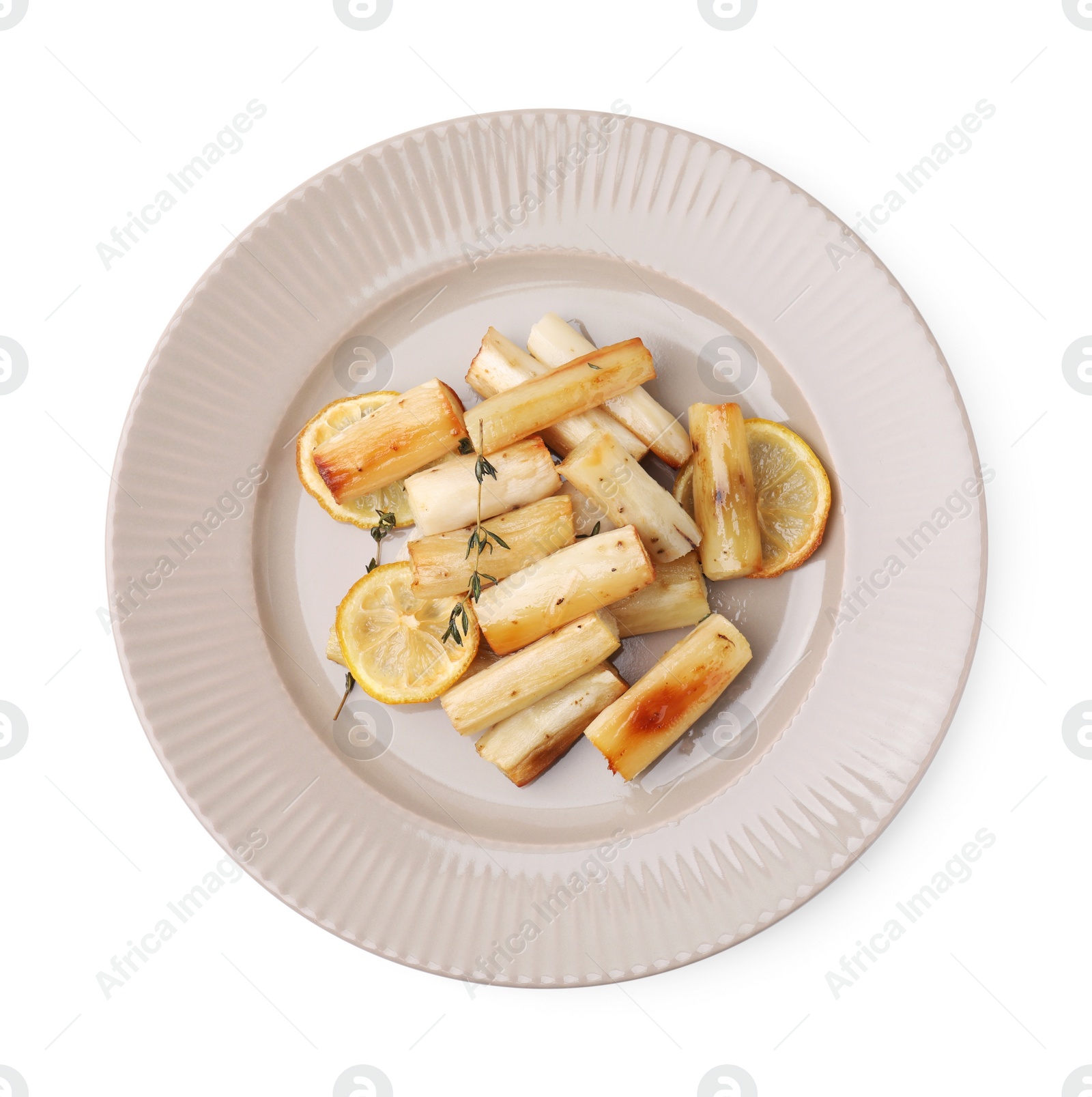 Photo of Plate with baked salsify roots, lemon and thyme isolated on white, top view