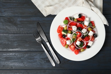 Photo of Plate with delicious salad on table, top view