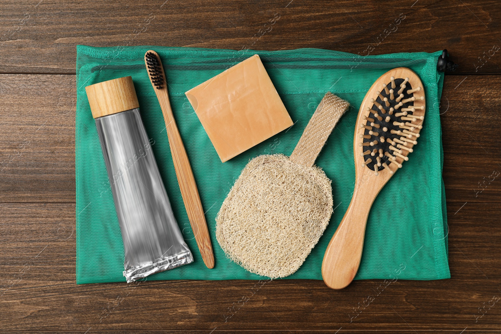 Photo of Flat lay composition with eco friendly products on wooden background. Conscious consumption