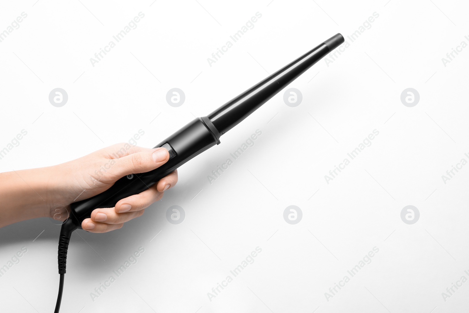Photo of Woman holding clipless curling hair iron on white background, closeup
