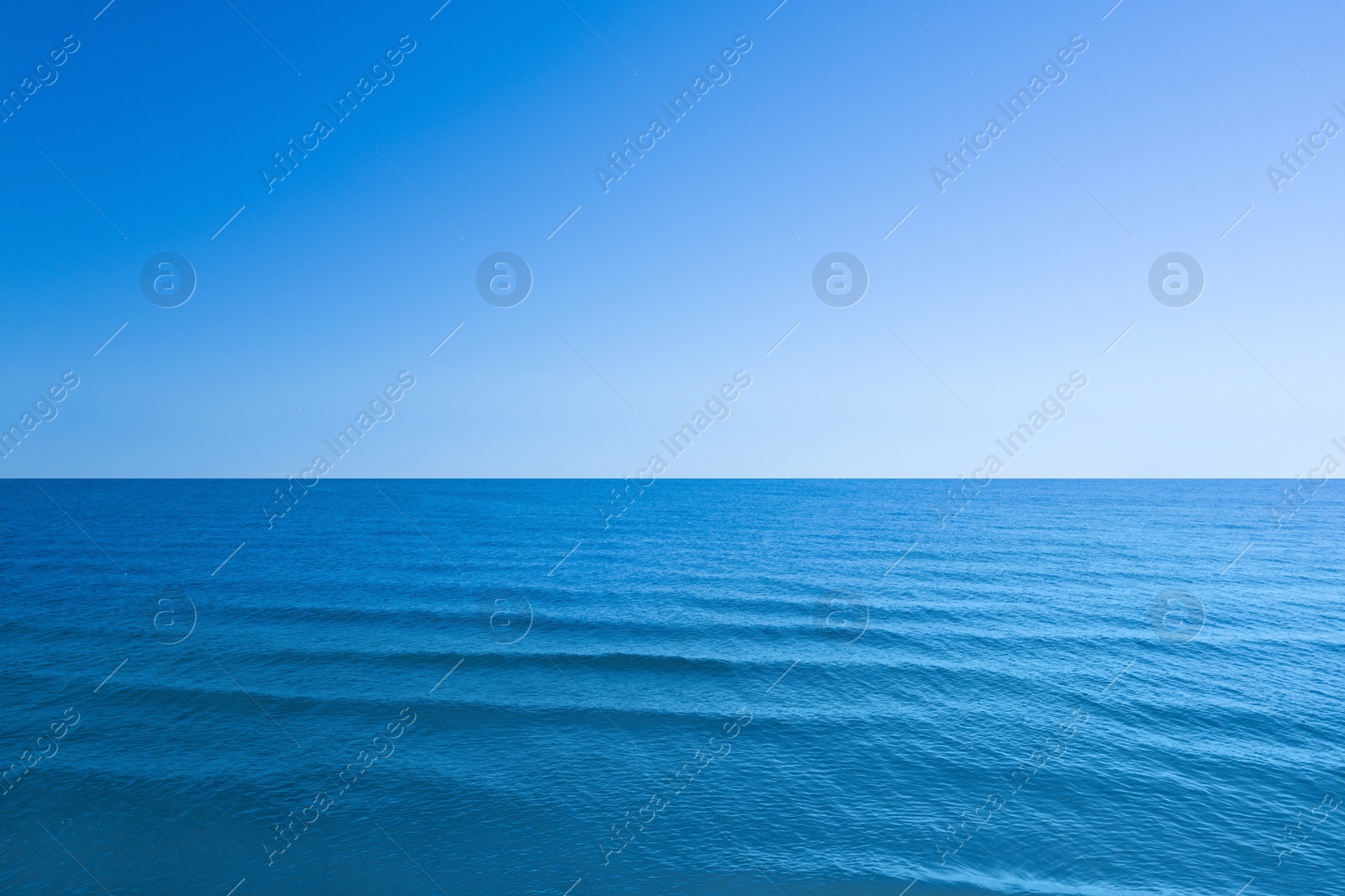 Image of Beautiful sea with waves under blue sky