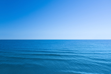 Image of Beautiful sea with waves under blue sky