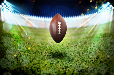 Image of Leather American ball on green football field