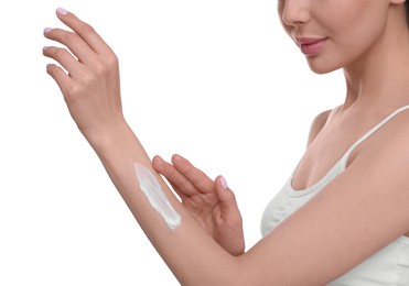 Photo of Woman with smear of body cream on her arm against white background, closeup