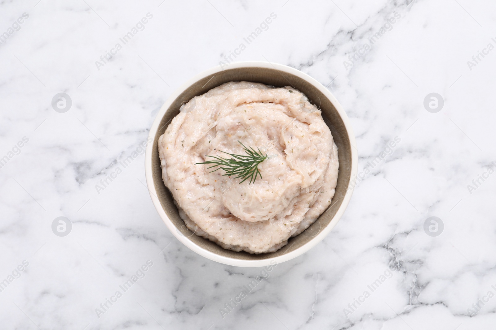 Photo of Delicious lard spread on white marble table, top view