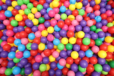 Photo of Many colorful balls as background, top view