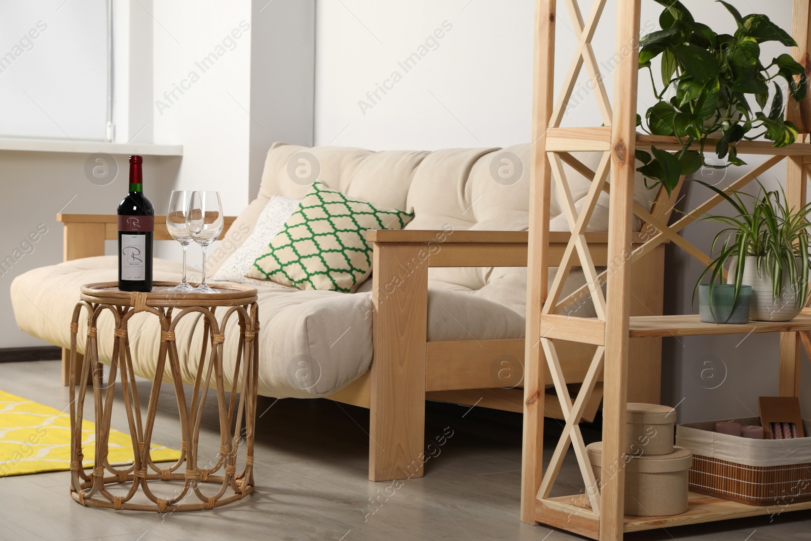 Photo of Stylish room interior with cosy wooden furniture
