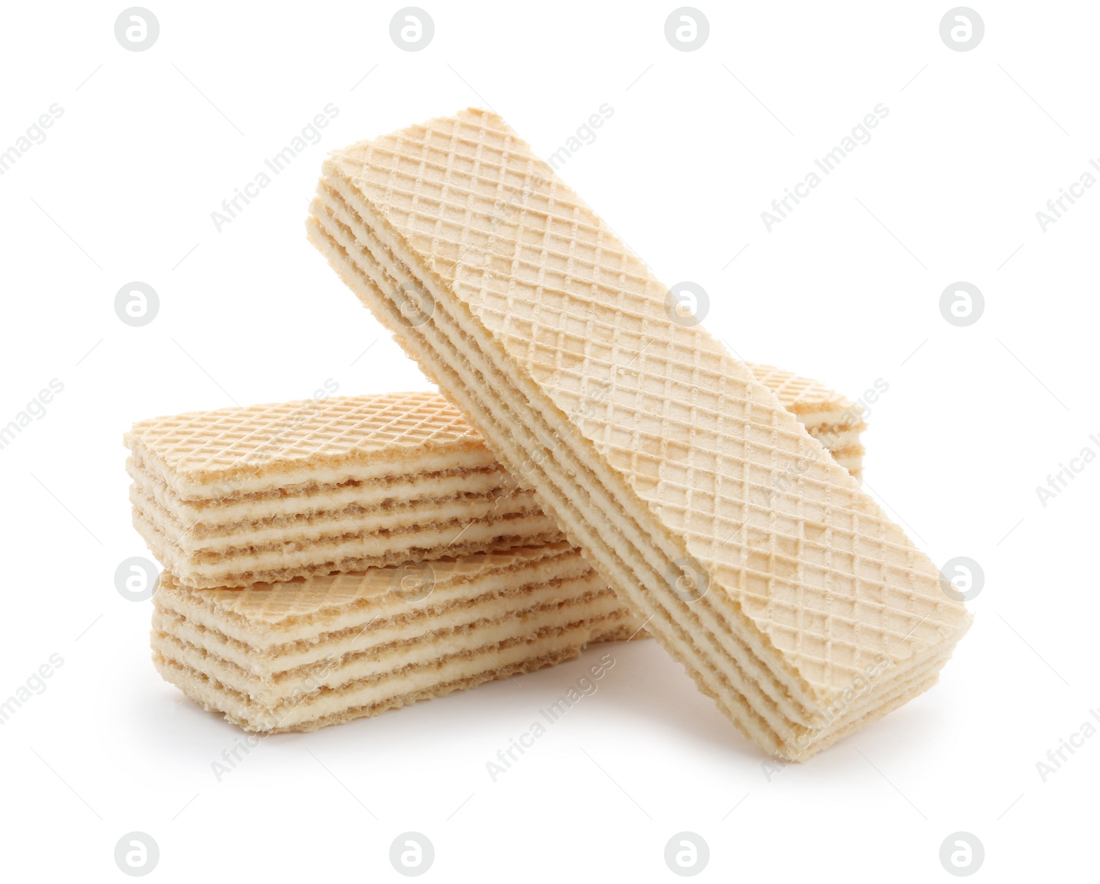 Photo of Delicious vanilla wafer sticks isolated on white