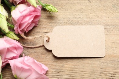 Happy Mother's Day. Beautiful flowers and blank card on wooden table