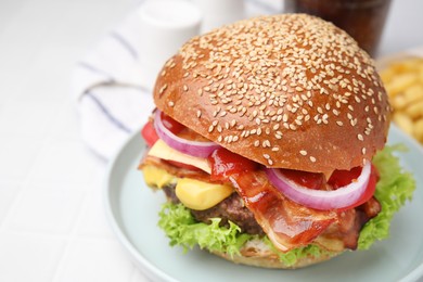 Photo of Delicious burger with bacon, patty and vegetables on white table, closeup